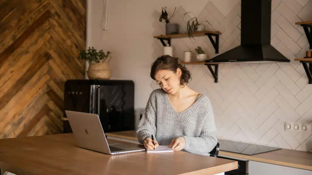 a copywriter working in a kitchen